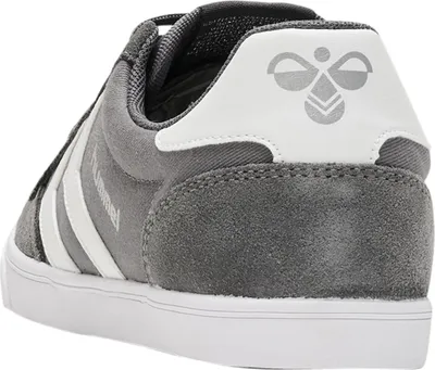 A close-up rear view of a grey Hummel sneaker.