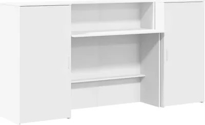 A white reception desk with two side cabinets and open shelving in the middle.