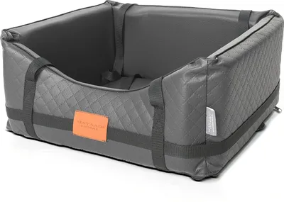 A dark gray quilted dog car seat is shown from a slightly elevated angle against a white background.