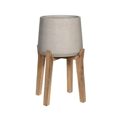 A beige-grey planter pot on a wooden stand, isolated on a white background.