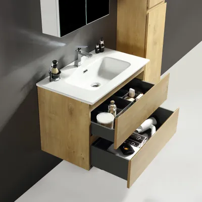 A bathroom vanity with a sink and drawers, showcasing toiletries and a hairdryer.