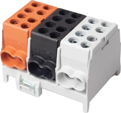 A product shot of three electrical terminal blocks in orange, black, and white, mounted on a white base.