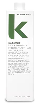 A product shot of a shampoo bottle against a white background.