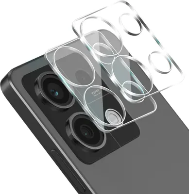 A close-up shot of a smartphone camera lens protector being placed onto a smartphone.