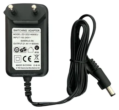A black switching power adapter with a coiled cable is displayed against a white background.