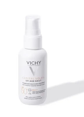 A white bottle of Vichy Capital Soleil UV-Age Daily SPF 50+ sunscreen is shown against a white background with a shadow.