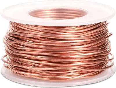 A spool of copper wire on a white background.