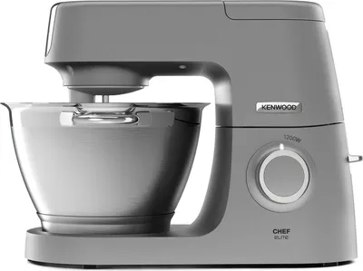 A gray kitchen mixer with a silver bowl is shown in a studio setting.