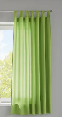 A green curtain hanging in front of a window.