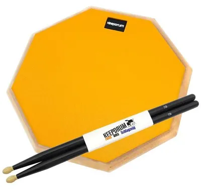 Immagine prodotto di keepdrum practice pad arancione da 12 pollici con bacchette nere