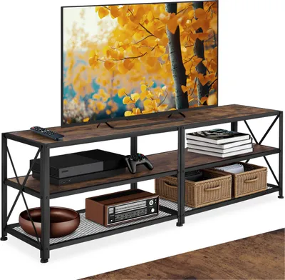 A TV stand with a television and various items on its shelves.