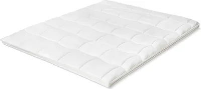A white quilted mattress topper is shown from a diagonal angle against a white background.