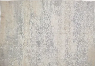 A flat lay of a vintage-style rug with a distressed pattern.