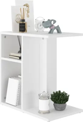 A white side table with decorative items on top and shelves.