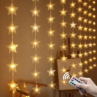 A string of star-shaped LED lights hanging vertically against a brown background.