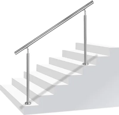 A stainless steel handrail is shown installed on a set of white stairs against a white background.