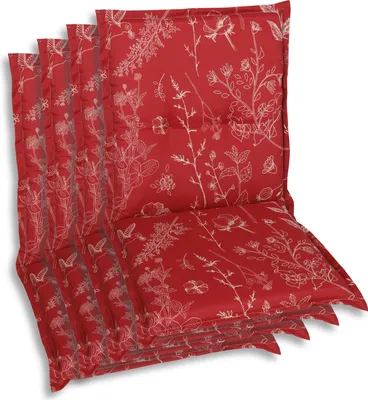 A stack of red chair cushions with a white floral pattern.