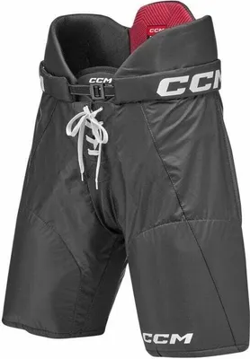 A pair of black hockey pants with white CCM logos and red lining.