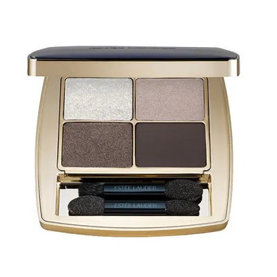 An open Estée Lauder eyeshadow palette with four shades and two applicators.