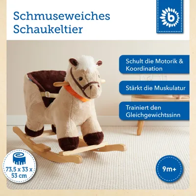 A plush rocking horse toy is shown in a room setting.