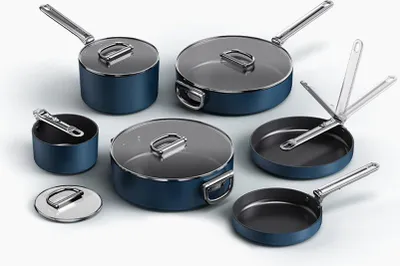 A set of blue cookware with silver handles and lids, arranged on a white background.