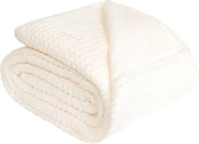 A folded cream-colored blanket is shown against a white background.