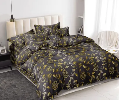 A bed with bedding set in a bedroom.