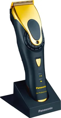 A professional hair clipper is shown in its charging stand against a white background.