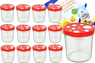 A set of twelve glass jars with red and white mushroom-themed lids, along with a recipe booklet.