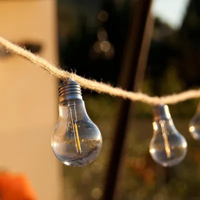 Zdjęcie produktu dla Zewnętrzne oświetlenie sznurkowe z 10 ciepłobiałymi żarówkami LED FANTASY CORD 7,70m