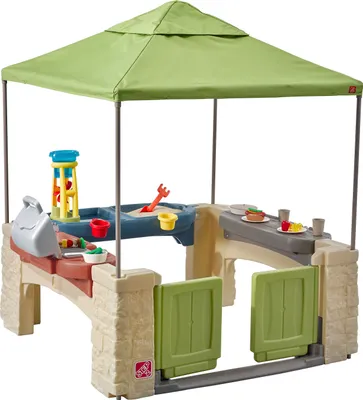 Produktbild von Step2 All Around Playtime Patio Spielhaus | Kunststoff Patio für Kinder mit Küche & Zubehör | Inklusive Sandtisch und Wasserspieltisch | Geeignet für