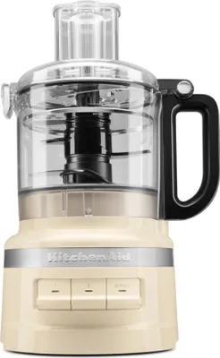 A cream-colored KitchenAid food processor is shown against a white background.