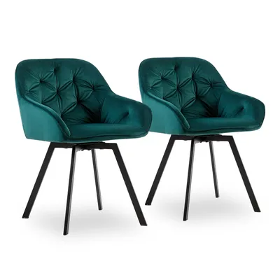 Two green velvet swivel chairs with black metal legs are shown against a white background.