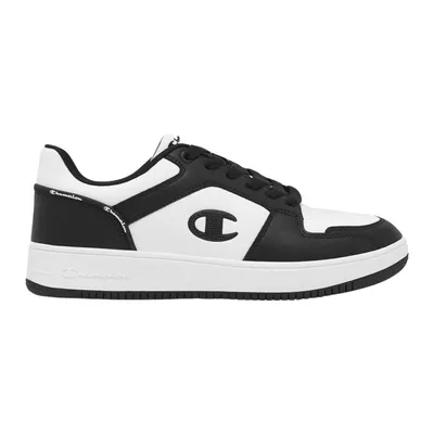 A black and white Champion sneaker shown from the side.