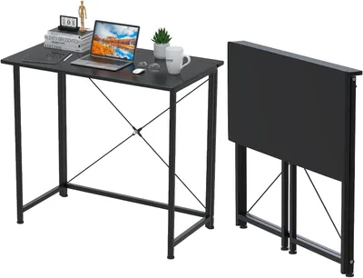 A black folding desk is shown in two states: set up and folded. The set-up desk has a laptop, books, and mugs on it. The folded desk is shown next to the set-up desk.