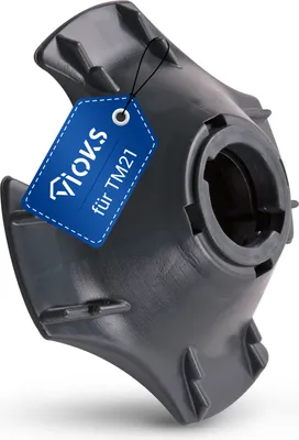 A black plastic part for a kitchen appliance, with a blue tag attached.