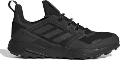 A black Adidas Terrex trail running shoe is shown from the side against a white background.