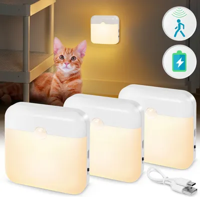 A ginger cat is sitting next to a shelf, with three motion-sensor night lights in the foreground. There are also two circular icons on the right side of the image.