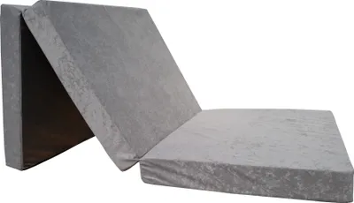 A gray folding mattress laid out on a white background.