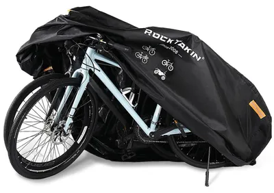 Immagine prodotto di Copertura impermeabile per biciclette, adatta a 2-3 biciclette, realizzata in tessuto Oxford 300D, resistente alle intemperie. Dimensioni: 200x90x100 cm. Include una sacca per il trasporto
