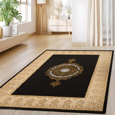 A rug is placed on a wooden floor in a living room setting.