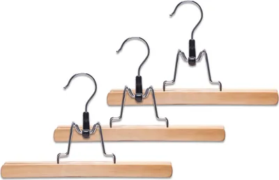 Three wooden hangers with silver clips and hooks against a white background.