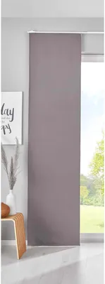A panel curtain hanging in front of a window.
