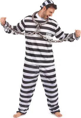 A man wearing a prisoner costume with chains.