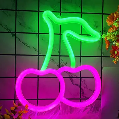 A neon sign shaped like cherries against a tiled background.