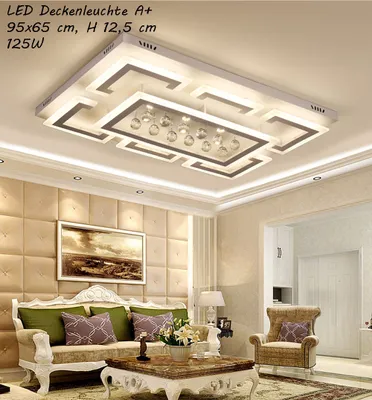 A modern living room with a large LED ceiling light fixture.