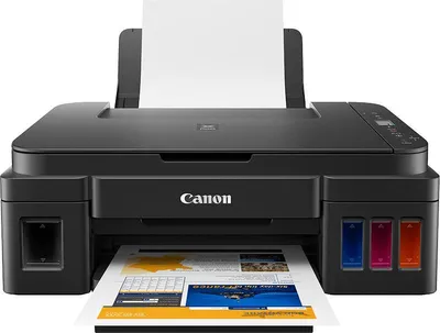A black Canon printer with paper loaded and printing a document.