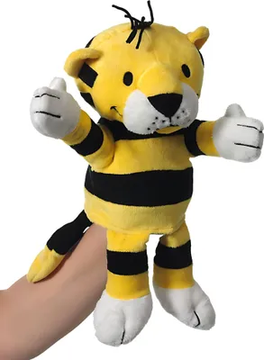 A stuffed tiger puppet with yellow and black stripes is held by a hand.