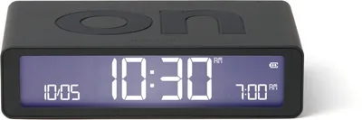 A black digital alarm clock with a digital display showing the time and alarm settings.