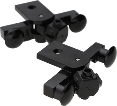 Two black LEGO magnetic couplings are shown against a white background.